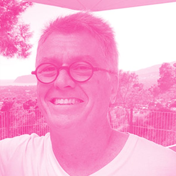 Paul Bate's headshot with a hot pink filter.