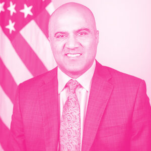Amit Mital's headshot with a hot pink filter.