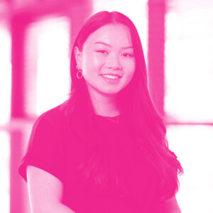 Lian Barkema's headshot with a hot pink filter.