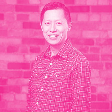 Ivan Yuen's headshot with hot pink filter.