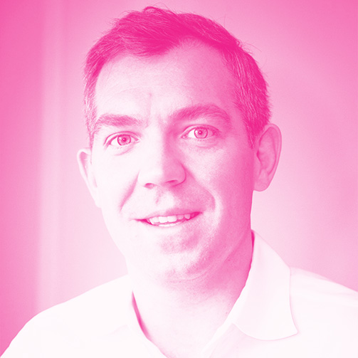 James Rivett's headshot with a hot pink filter.