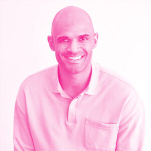 Kenndal McArdle's headshot with a hot pink filter.