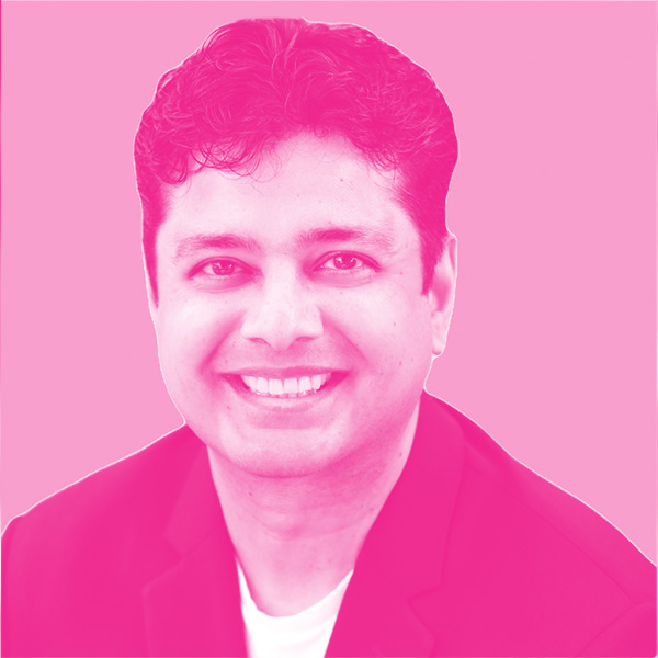 Anand Thaker's headshot with a hot pink filter.